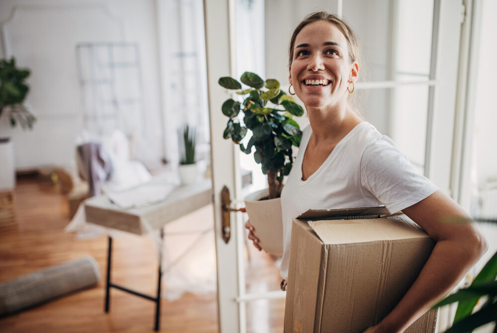 Woman arriving in new apartment
