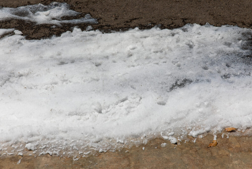 Environmental Hazard: Toxic PFOS Firefighting Foam Spill on Urban Street