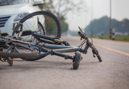 Accident car crash with bicycle on road because drunk driving.